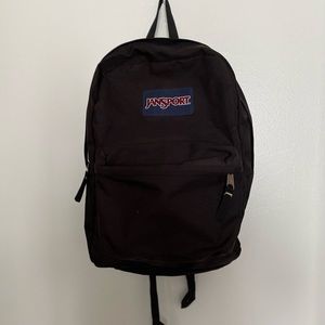 Jansport Backpack: Black with front pocket and adjustable straps